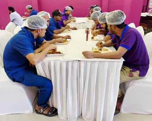 Hotel CAPS employees sharing a special team meal together