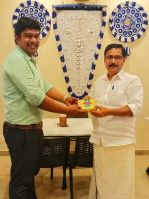 Hotel CAPS presenting a token of appreciation to the Nemmara MLA