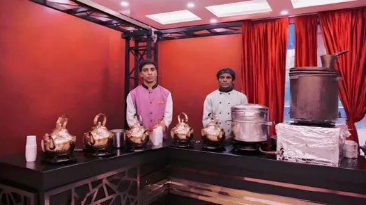 Hotel CAPS outdoor catering team preparing a live food counter