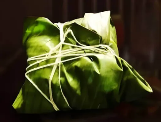 Traditional banana leaf wrapped food parcel